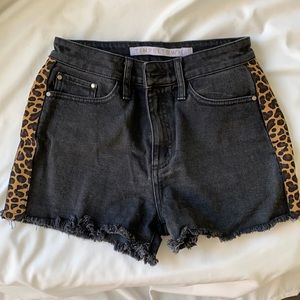 Black shorts with cheetah print on side